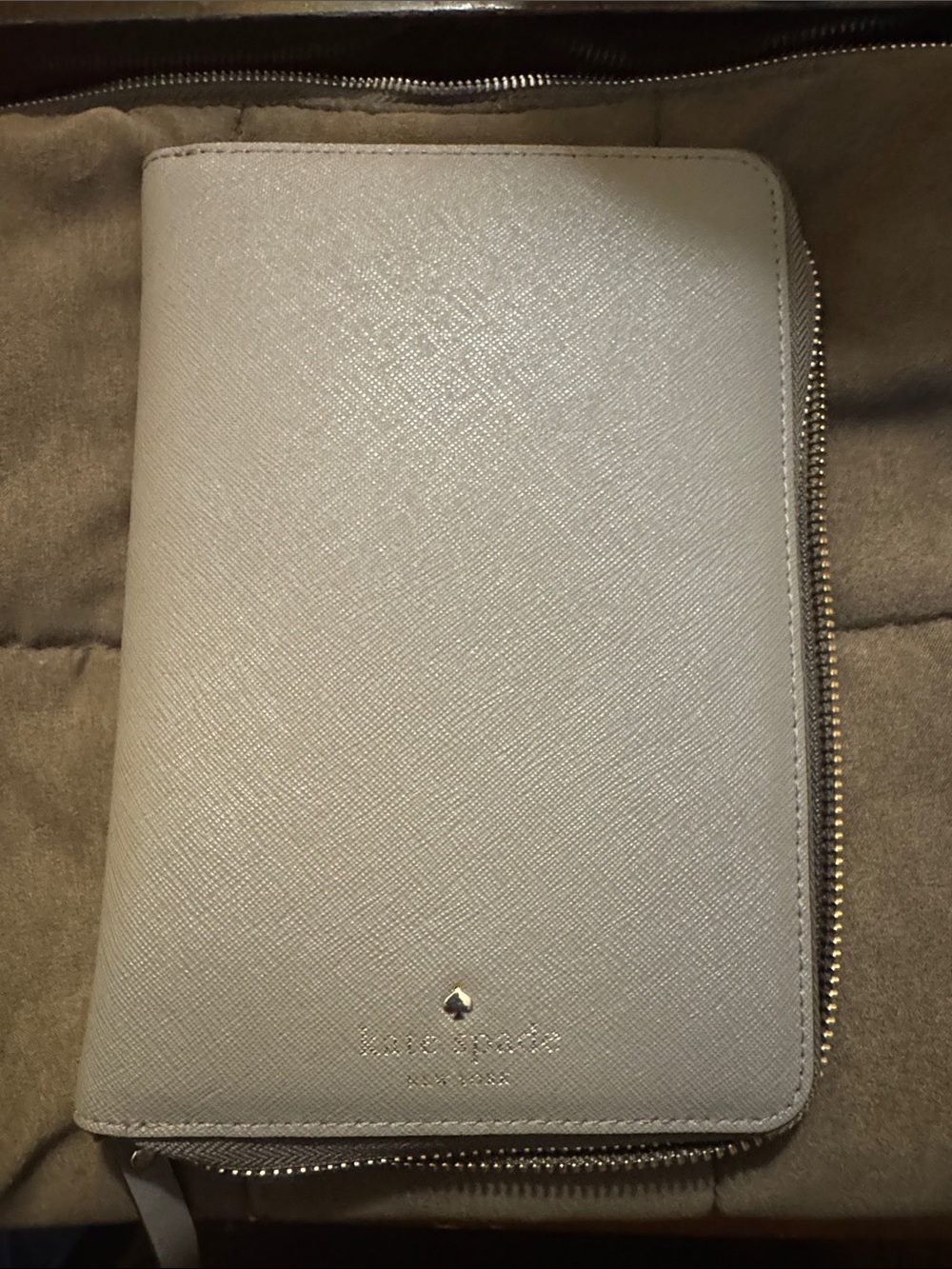 kate spade light gray zip-around saffiano wallet with gold accents